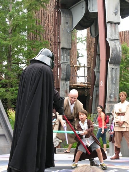 Child dressed as a Jedi facing Darth Vader at the Star Wars Experience in Hollywood Studios, Florida
